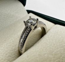 18ct diamond solitaire ring, with chip diamond set shoulders, 0.5ct stone, size O, 3.3g