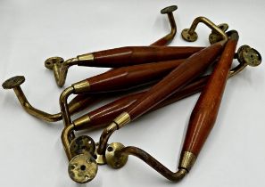 Set of six brass and teak rails or door handles, 45cm long (6)