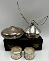 Mixed silver - cased Christening spoon and napkin ring, two further napkin rings, silver lidded