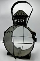 19th century circular pierced sheet metal storm lantern, two caged glass panels, 40cm high