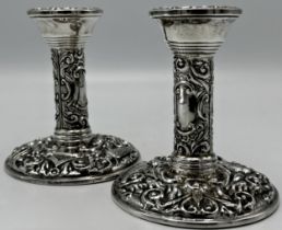 Pair of 1960s silver Victorian style embossed candlesticks, maker B & Co, Birmingham 1964, 10cm high