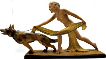 Classic 1930s plaster figure of a nude female being pulled by an Alsatian dog on a lead, L 59cm