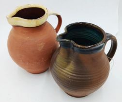 The estate of Peter & Joy Evans of Whiteway, Stroud - Studio Pottery beer jug x2. One Marked with S