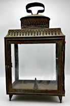 19th century pierced sheet metal storm lantern with four glass panels, 45cm high