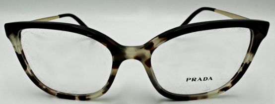 A pair of Prada woman's eyeglasses with tortoiseshell frame. Model number VPR 07W 52017. In unused