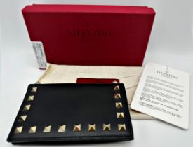 Valentino black studded Garavani wallet in black leather. With press stud closure, ten card slots,