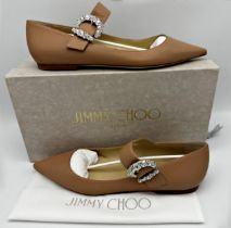 A pair of Jimmy Choo Cheri flat shoes in powder pink with embellished jewelled buckle. Size 40.