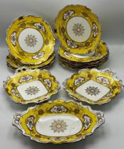 Coalport hand painted porcelain desert service with floral sprays and gilt overlay on a yellow