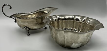 Mappin and Webb silver sauce boat, London 1913, 16cm long with a further lobed silver sugar bowl,