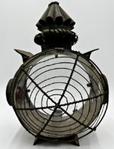 19th century circular sheet metal storm lantern, twin glass panels flanked with smaller side panels,