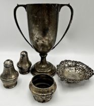 Mixed antique silver - twin handled trophy, Victorian pierced dish and three piece cruet, 10.5oz