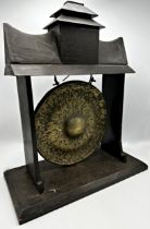 Antique brass gong in ebonised pagoda frame, 55cm high