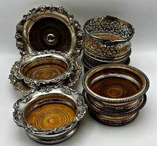 Three pairs of antique silver plated wine coasters together with a further four examples with turned