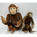 Two straw stuffed monkeys