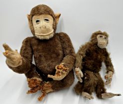 Two straw stuffed monkeys