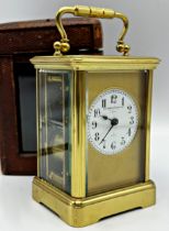 Early 20th century Goldsmiths Company of London striking carriage clock, circular enamel dial, A