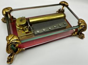 Vintage glass case Reuge of Saint Croix 72 note 3 airs music box, on gilt brass dolphin feet, 24cm