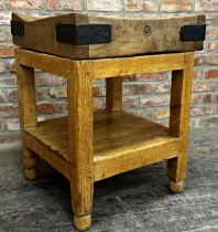 Good antique butchers block, the top with iron strapwork and perfect patina, on a waxed pine base,