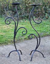 Pair of scrolled wrought iron pricket sticks, 117cm high