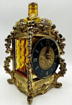 Novelty brass cased musical decanter stand in the form of a Lantern Clock, 26cm high