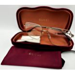 A pair of Gucci silver tone full-rim square metal eyeglasses featuring iconic Horsebit motif on