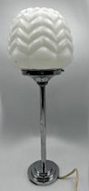 Art Deco chrome and opaline glass table lamp, with shaped faceted shade upon a singular column and