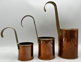 Three 19th century copper and brass measures for 2pint, pint and half pint. The largest 27.5cm