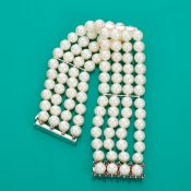 Vierreihige PerlenArmband mit Rubinschließe