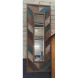 *EX DISPLAY* Bevelled mirror with multi coloured wooden frame.