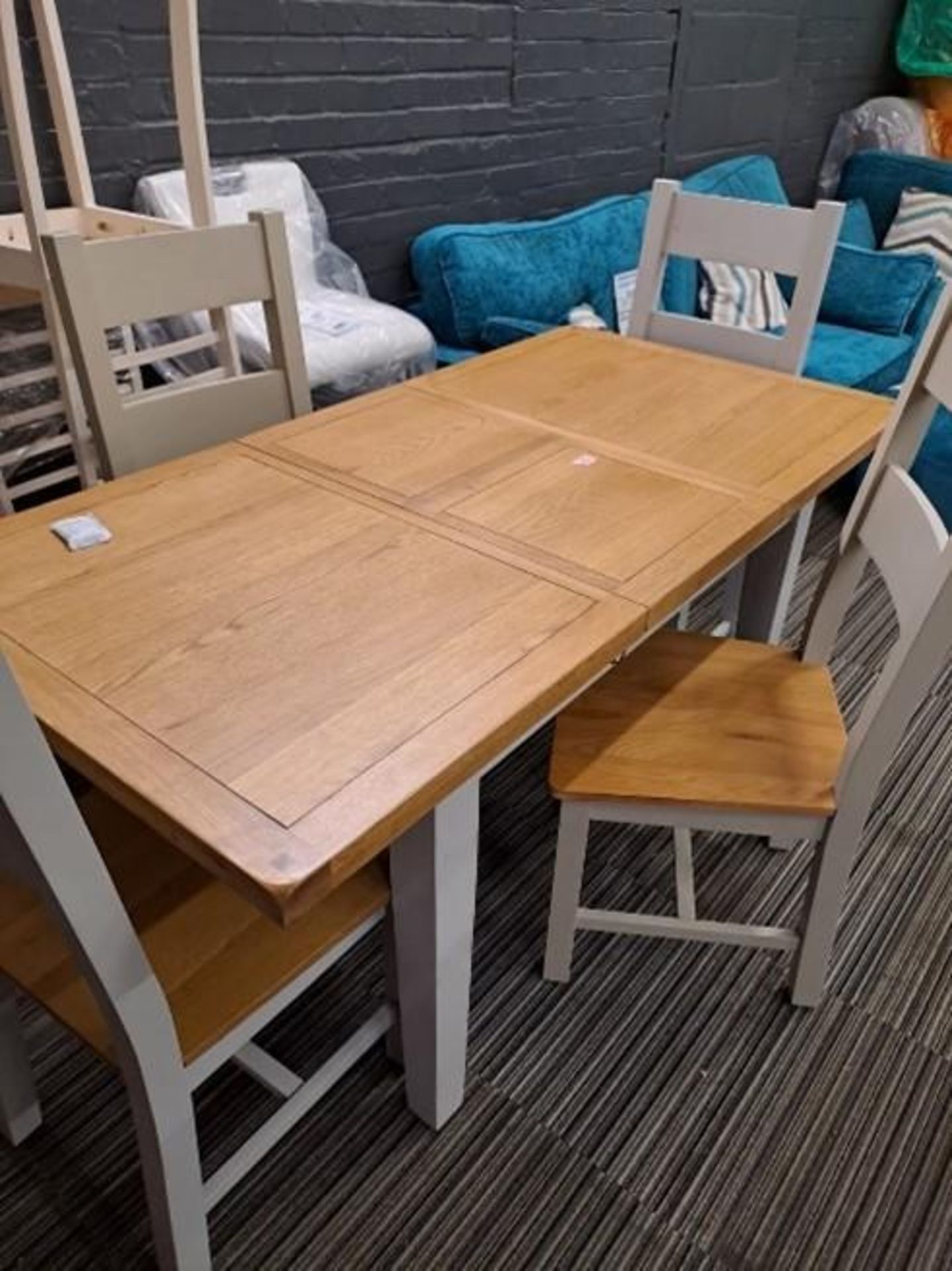 *EX DISPLAY* IFD Melbourne oak extending dining table with flip over centre leaf with 4 chairs.