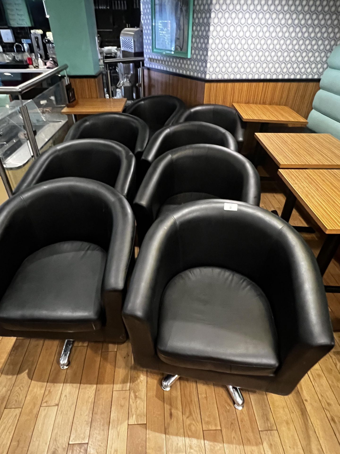 8 x Black faux chrome base swivel tub chairs