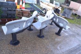 Three heavy duty commercial curved three seater benches together with a table