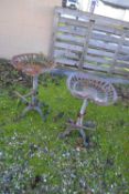 Pair of cast iron bar stools, height approx 65cm