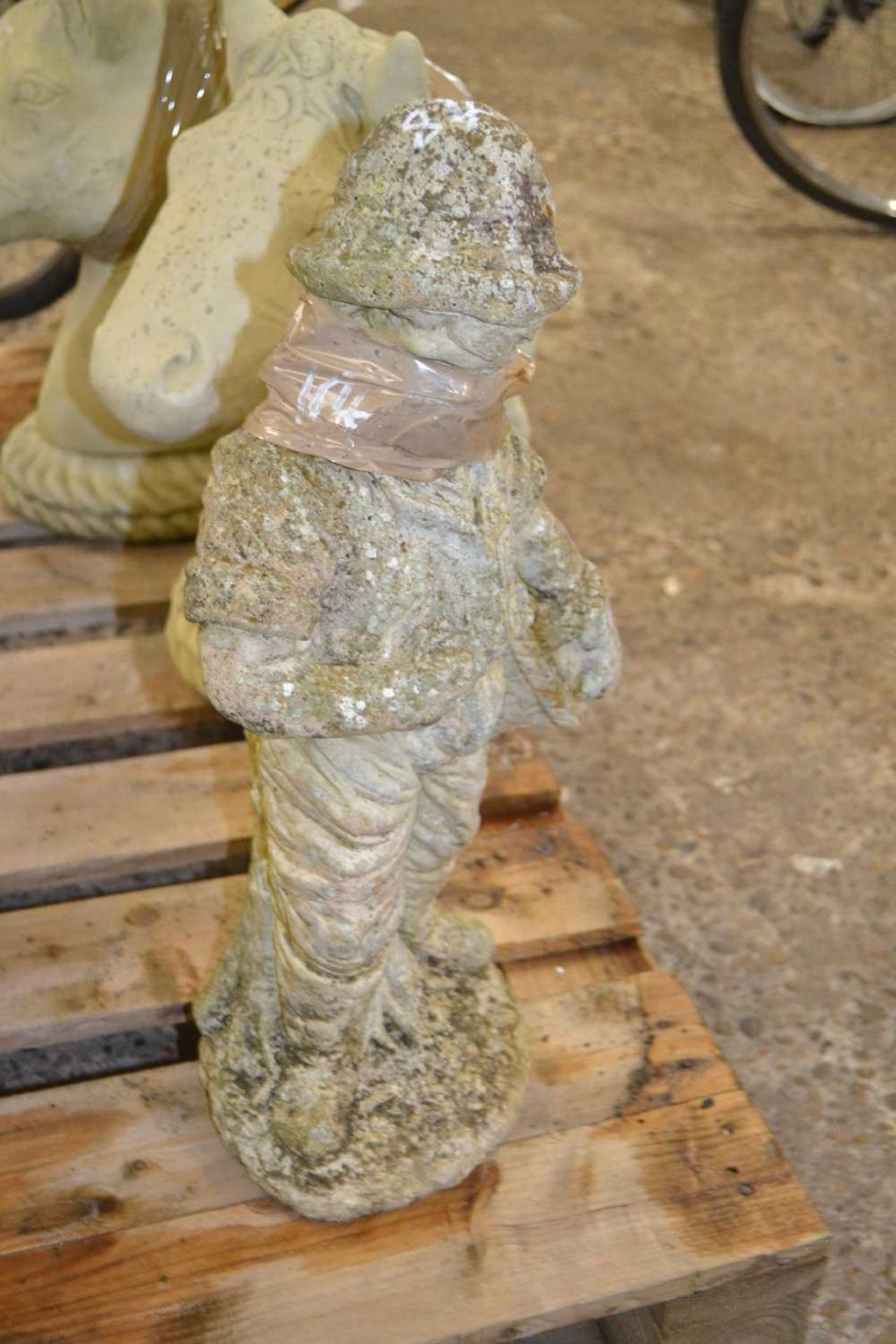 Composite garden statue formed as a boy, height 55cm