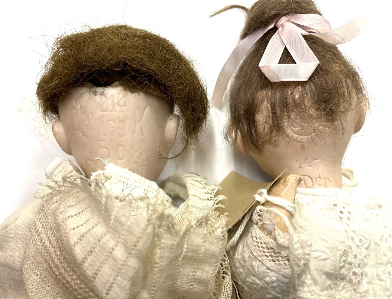 A pair of Gebruder Kuhnlenz bisque head dolls, to include: - An open-mouthed with blue eyed, - Image 2 of 2