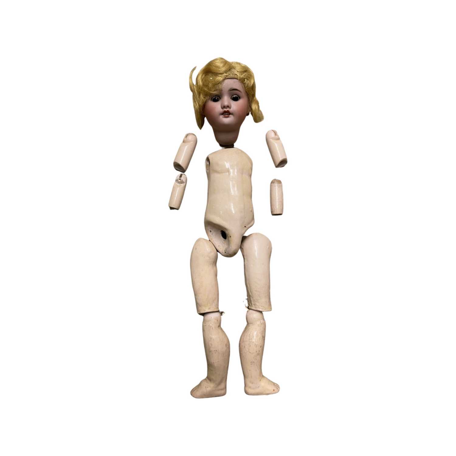 SFBJ bisque head doll for restringing. Black eyes, blonde hair, lacking elbow joints. Marked to back