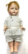 A rare Heubach bisque head doll, in striped outfit. Close-mouthed, blue eyes (damage to eyelids),