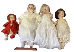Four small German bisque head dolls: - Heubach Koppelsdorf in red knitted outfit. Marked to back