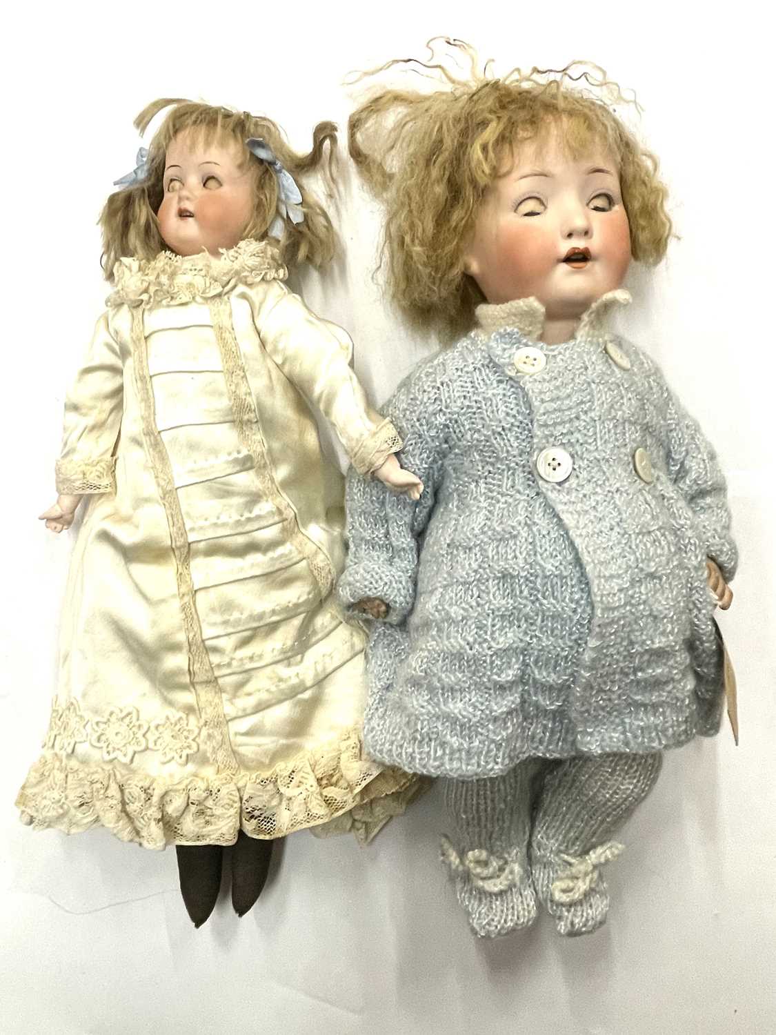 A pair of Heubach Koppelsdorf bisque head dolls, to include: - Open-mouthed, marked 275.76/o to nape