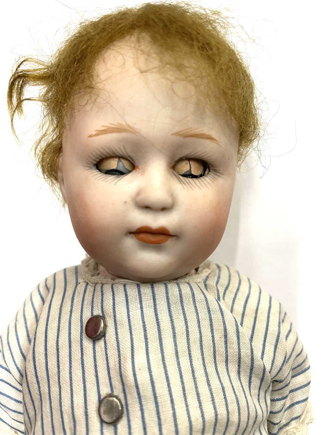 A rare Heubach bisque head doll, in striped outfit. Close-mouthed, blue eyes (damage to eyelids), - Image 3 of 3