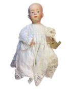 Gerbruder Heubach bisque head doll in white gown. Length approximately 30cm.