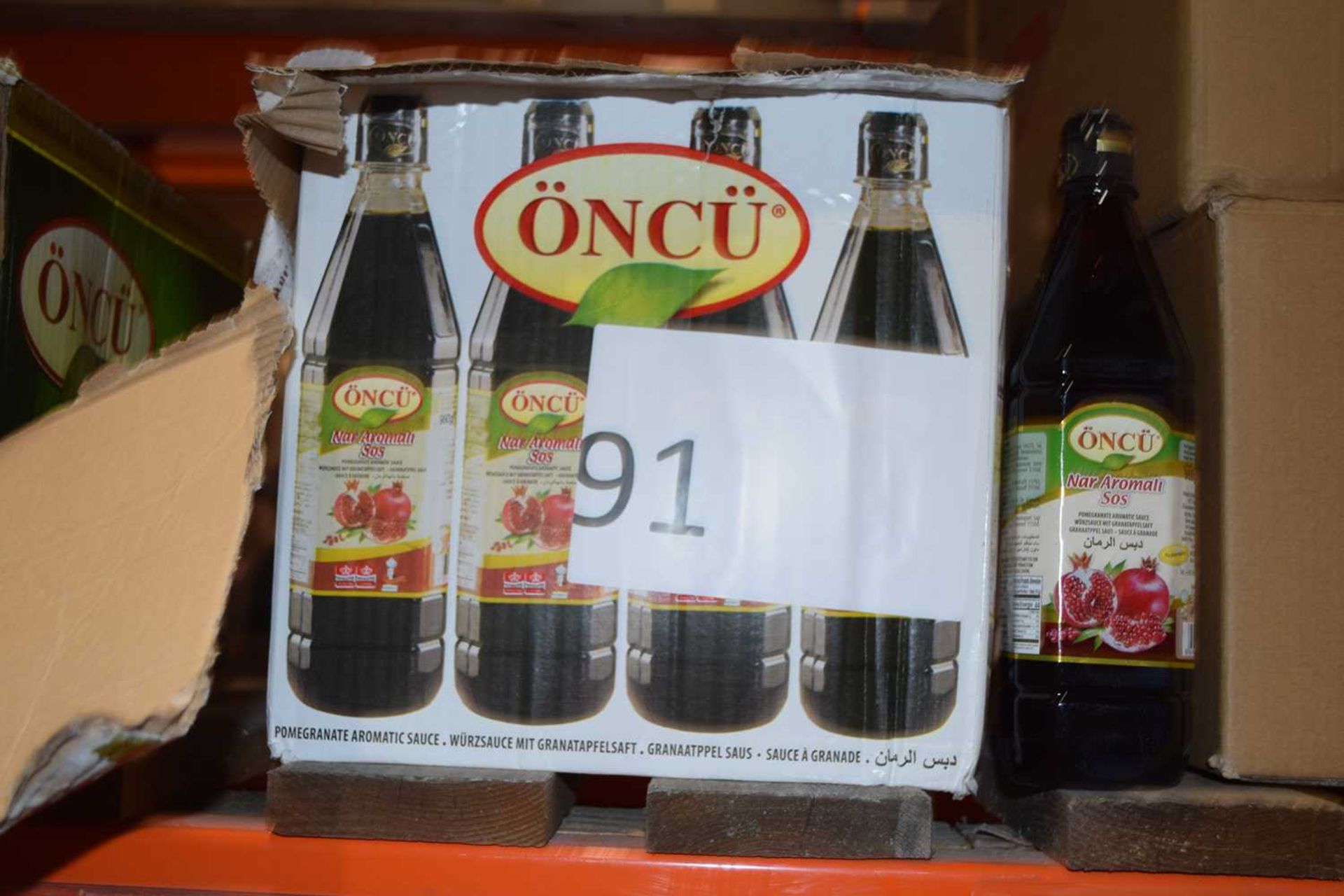 Two boxes containing bottled Aromatic Pomegranate Sauce, each box containing 8 1 litre bottles