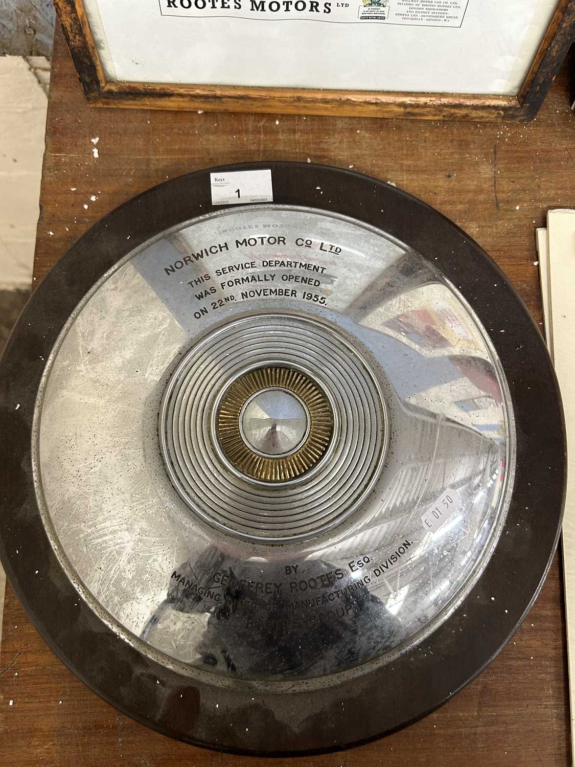 Mounted hub cap/Presentation plaque for the Norwich Motor Company Ltd, for the opening of the