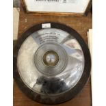 Mounted hub cap/Presentation plaque for the Norwich Motor Company Ltd, for the opening of the