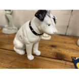 Cast iron money box formed as a dog, height approx 15cm