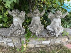 Three small matching garden statues formed as cherubs, height approx 38m