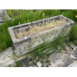A large composite planting trough, width approx 120cm, depth 40cm, height approx 35cm