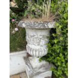 A pair of matching composite garden urns, height approx 95cm, width approx 70cm