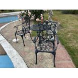 A decorative metal garden bistro set comprising a table and two chairs