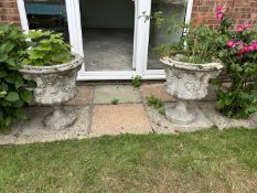 A set of four matching composite garden urns, height 65cm, width approx 60cm